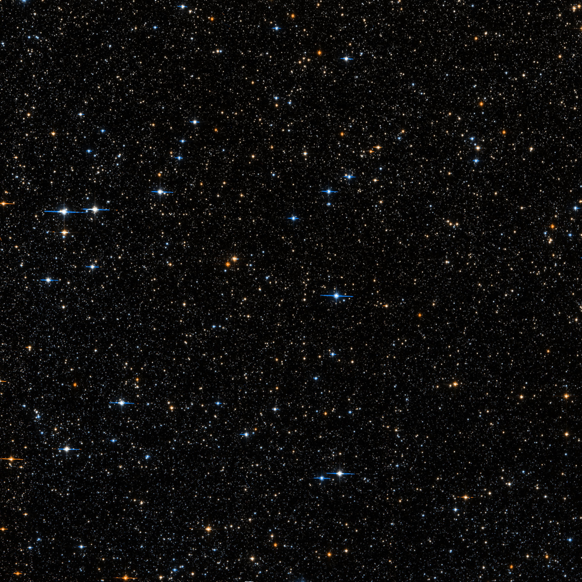 A square view of a field with many stars. The stars range from orange to blue and white. Many of the bright stars show diffraction spikes.